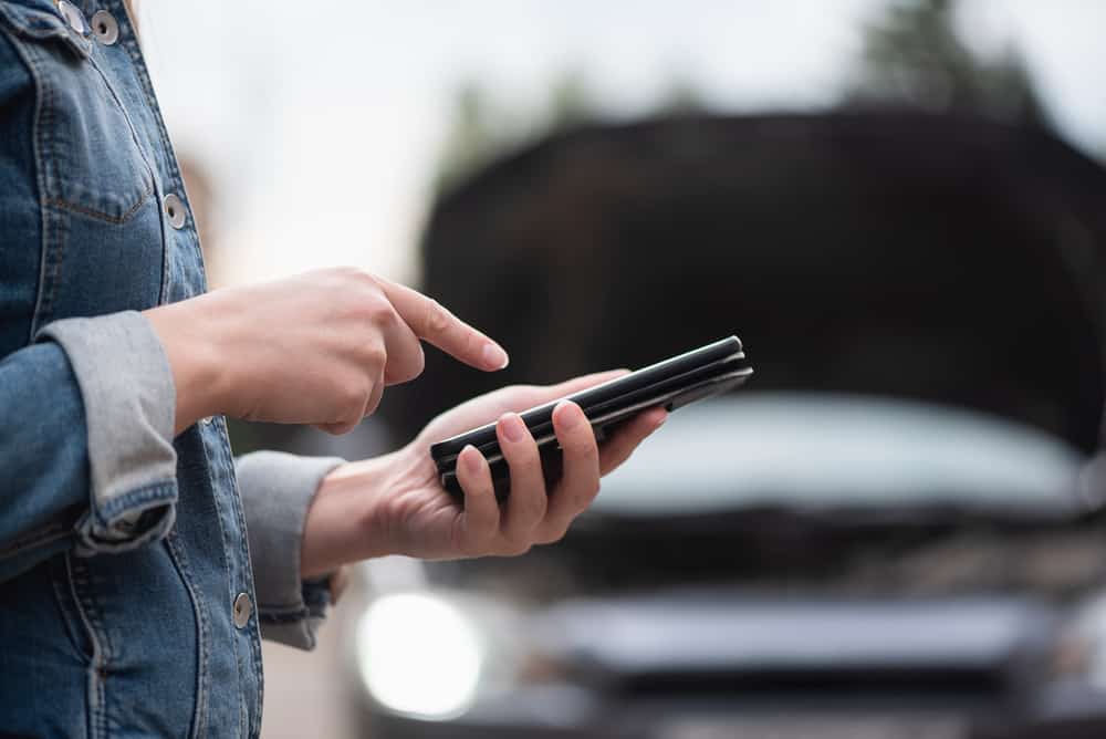 A person calling for professional in vehicle towing